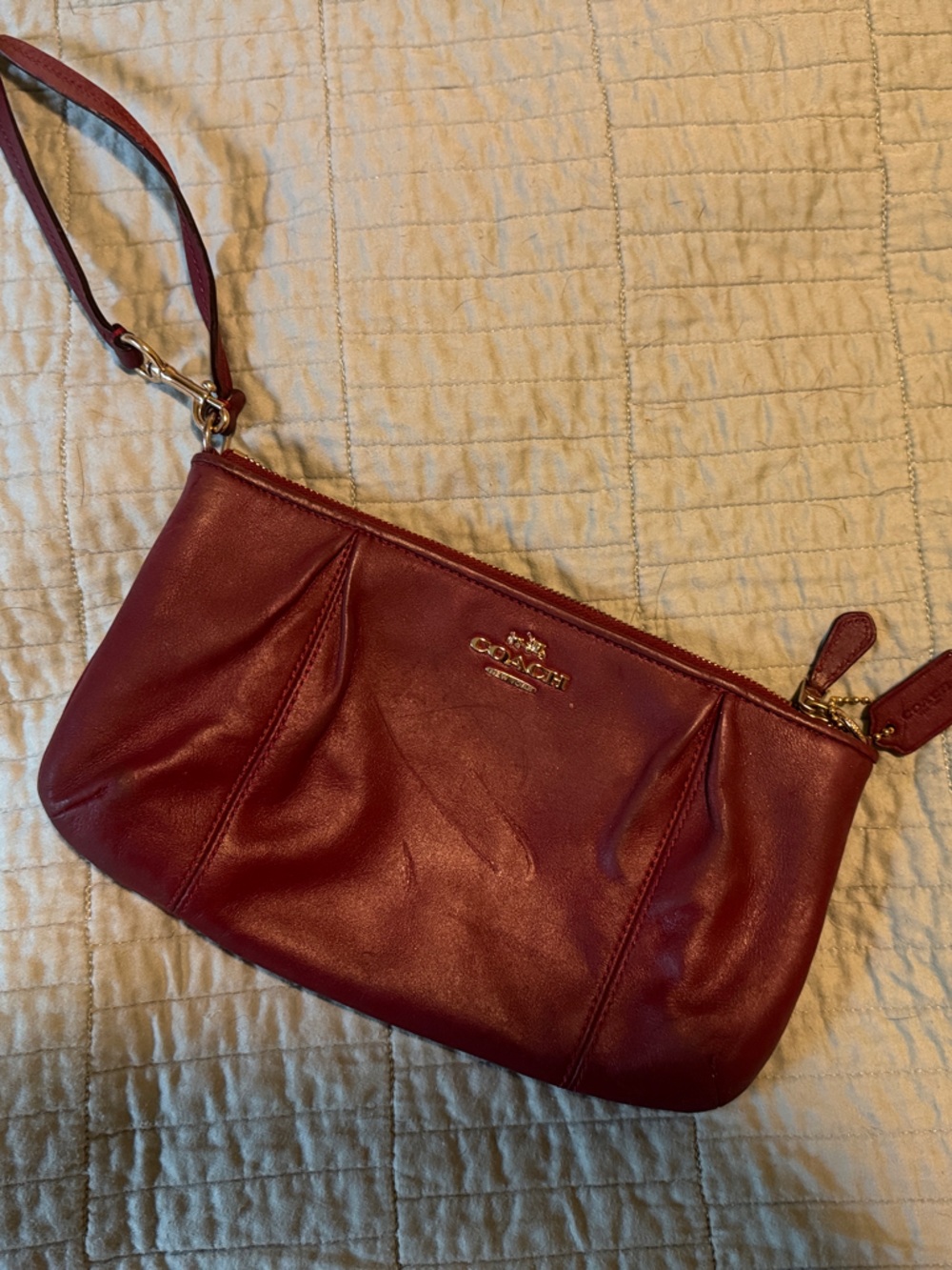 Coach Wristlet in Burgundy with Gold Hardware